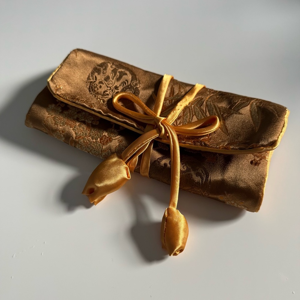New - golden jewelry travel pouch (purchased in Singapore)